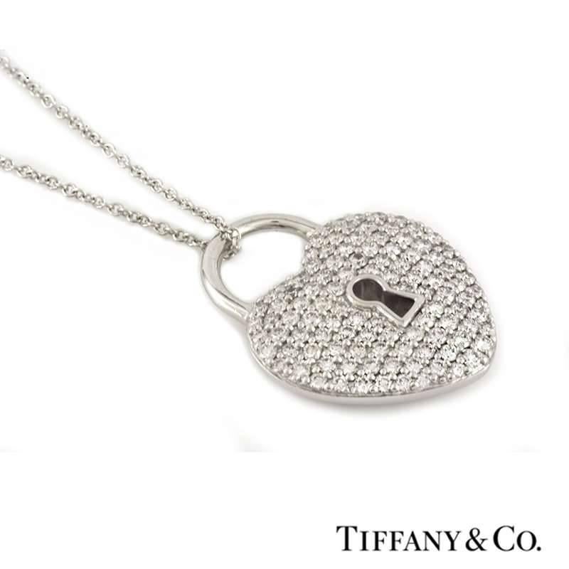 A stunning diamond heart pendant from the Tiffany Locks collection by Tiffany & Co. Set in platinum the pendant is composed of a heart lock motif pave set with round brilliant cut diamonds totalling 0.76ct, predominately G+ colour and VS+ in