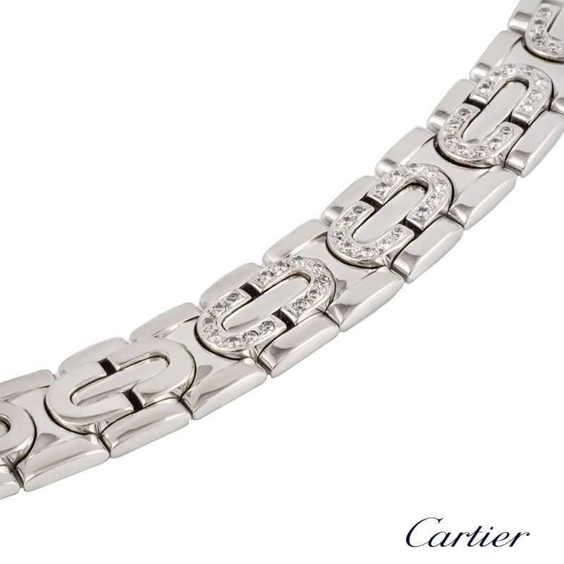 An 18k white gold diamond set necklace from the Cartier Maillon collection. The necklace is set to the front with 5 pave set round brilliant cut diamond lozenge shape motifs totalling approximately 1.00ct, predominantly F+ colour and VVS clarity.