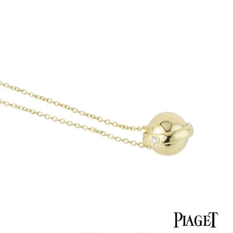 A beautiful 18k yellow gold diamond pendant from the Possession collection by Piaget. The necklace is set to the centre with a round ball motif pendant which is accentuated with a middle rotating band. The band features a single round brilliant cut