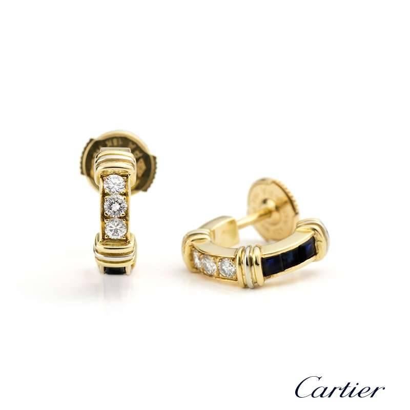 Cartier 18k yellow gold half hoop earrings set with 6 round brilliant cut diamonds totalling 0.30ct, E/F Colour, VVS Clarity. Channel set with 6 square cut blue sapphires totalling 0.42ct.  The diamonds and sapphires are separated by the iconic