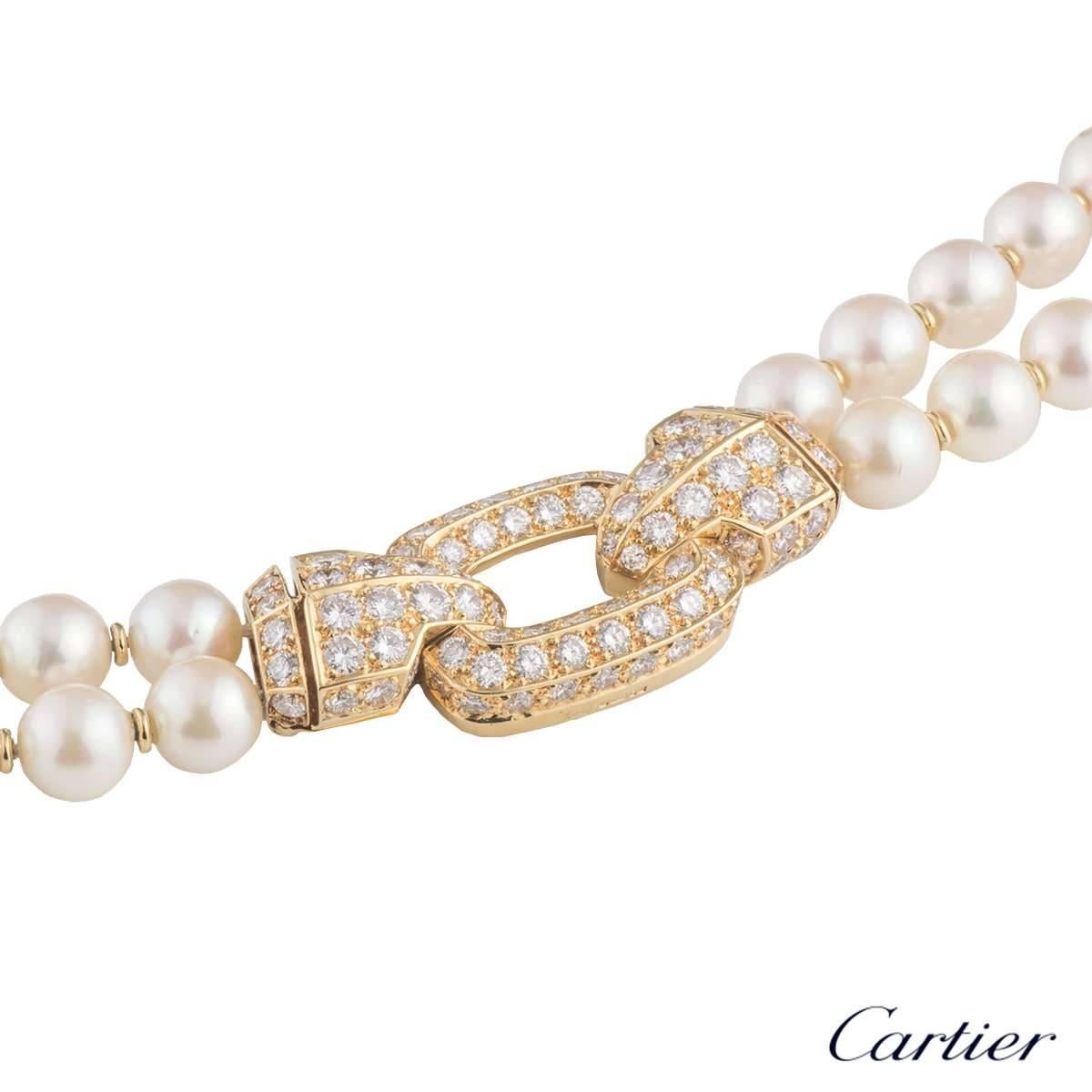  A beautiful 18k yellow gold Cartier diamond and pearl necklace. The necklace comprises of two strands of pearls, each at slightly different lengths. The inner strand consists of 51 pearls with gold dividers in between each. The outer strand