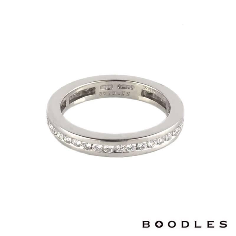 A gorgeous full diamond eternity ring in platinum by Boodles. The ring is set throughout the centre with 38 channel set, round brilliant cut diamonds totalling 0.61ct, predominantly F/G in colour and VS in clarity. The ring measures 3mm in width.