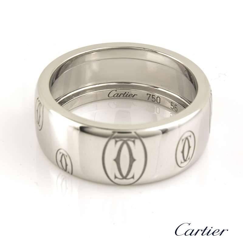 An 18k white gold C de Cartier Happy Birthday ring. The 8mm band features the traditional double C signature stamp and is a US size 7 1/4, EU size 56 and UK size O 1/2. The ring has a gross weight of 10.73 grams.

The ring comes complete with a
