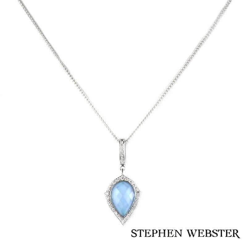 An 18k white gold turquoise quartz pendant from the Stephen Webster Crystal Haze collection. The pendant is set to centre with a pear shaped turquoise quartz, complemented by a halo of 24 pave set round brilliant cut diamonds and a diamond set bale