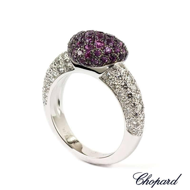 A beautiful18k white gold pave set diamond and amethyst heart ring. The ring consists of a heart motif set to the centre with 71 round brilliant cut amethysts totalling 1.11ct. The ring also features diamond set shoulder with 74 round brilliant cut