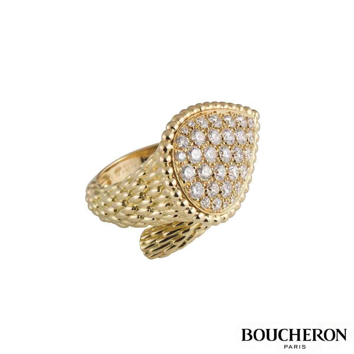 A fabulous 18k yellow gold Boucheron diamond ring from the Serpent Boheme collection. The ring comprises of a textured spiral ring leading up to a tear drop motif with beading around the outer edge, with 32 round brilliant cut diamonds in a pave