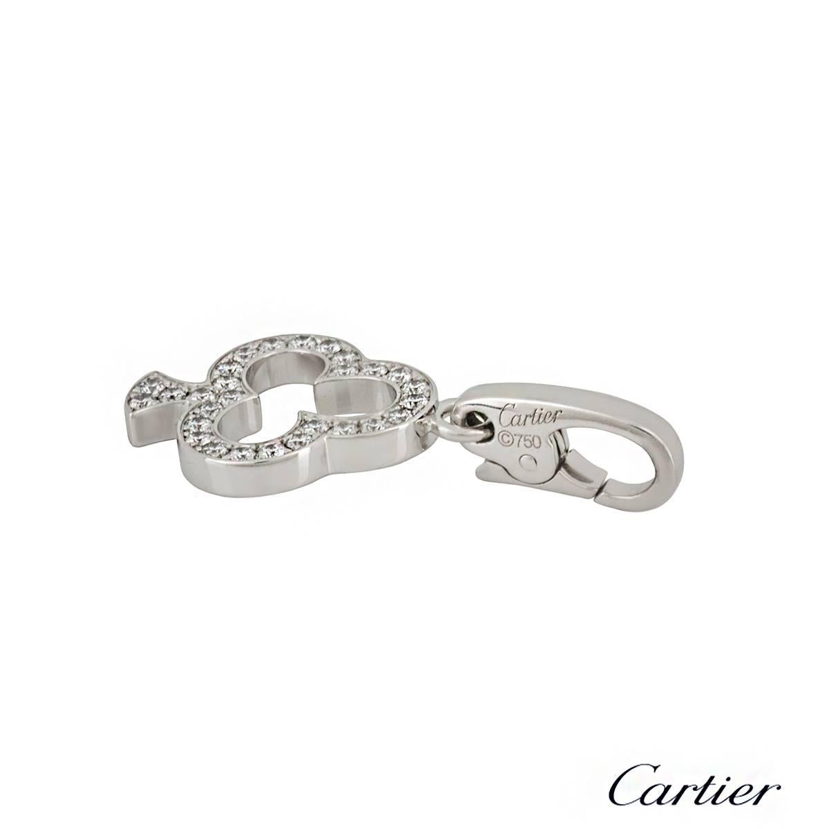 An 18k white gold charm pendant by Cartier. The club motif is set with 28 round brilliant cut diamonds totalling approximately 0.20ct. The 1.5cm charm features a lobster clasp at the top and has a gross weight of 2.82 grams. The charm comes complete