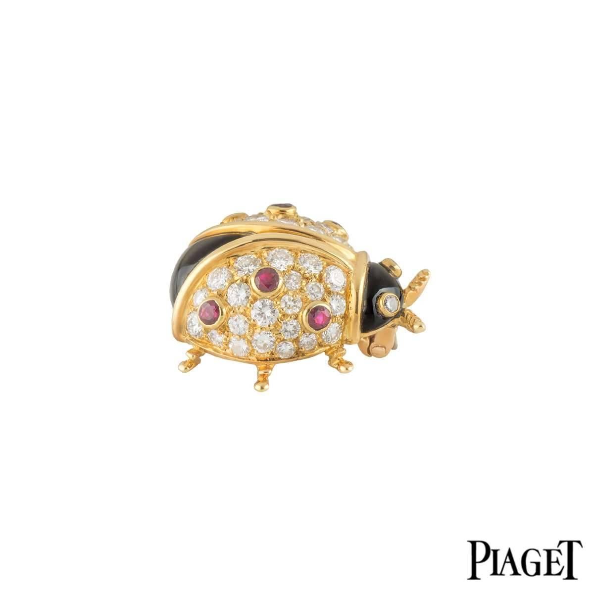 An 18k yellow gold Ladybird brooch by Piaget. The Ladybird is set to the back with 42 round brilliant cut diamonds totalling approximately 0.86ct, with a further 2 diamonds set to the eyes totalling 0.03ct, complimented by black enamel sections for