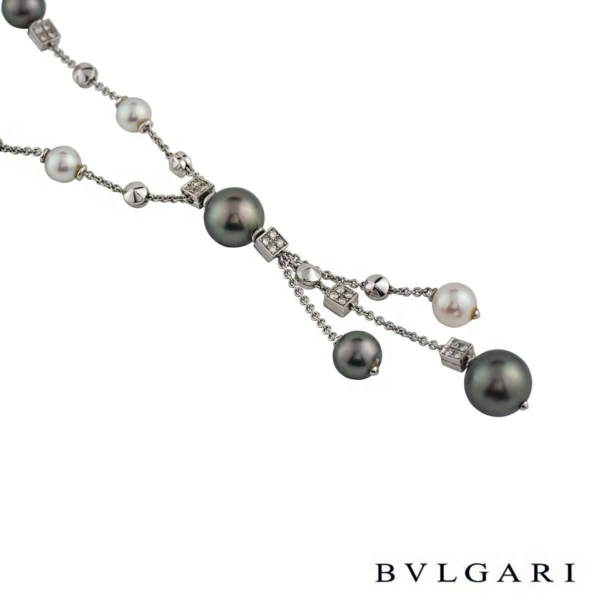 A beautiful pearl and diamond necklace from the Lucea collection by Bvlgari. The necklace features both Tahitian and white/pink pearls in a mixture of sizes, spread along the necklace and the vertical drop. The necklace also features 6 square links