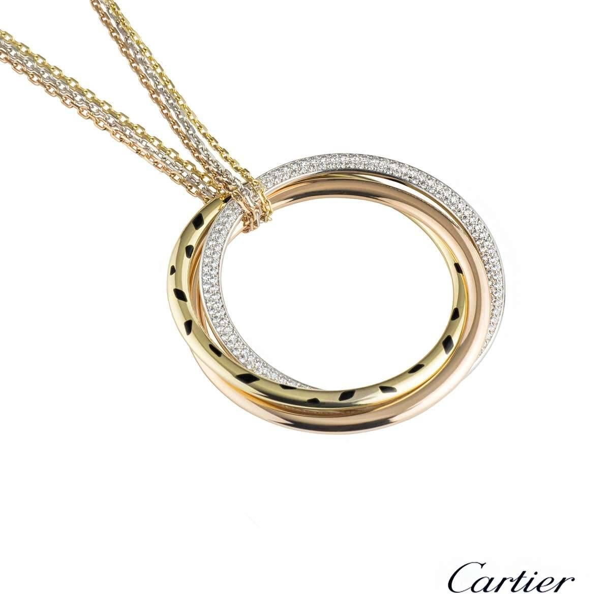 A stylish 18k tri-colour gold Cartier diamond and lacquer pendant from the Trinity de Cartier collection. The pendant comprises with 3 intertwined circle motifs. The white gold motif is pave set with 178 round brilliant cut diamonds with a total