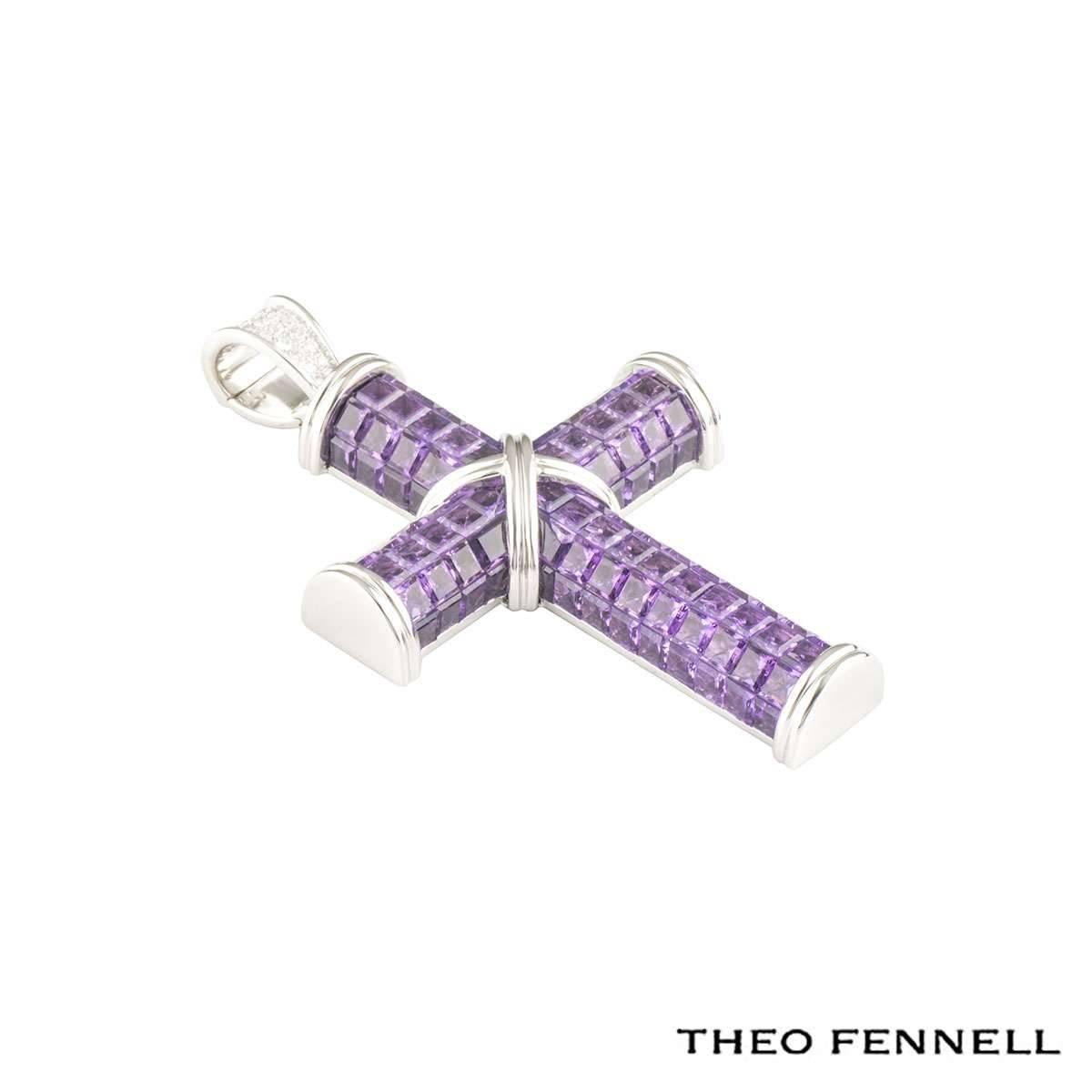 An 18k white gold cross pendant by Theo Fennell from the Crosses collection. The pendant features 109 square cut amethyst stones, totalling approximately 21.80ct. The pendant has a white gold 'X' set to the centre with matching raised terminations