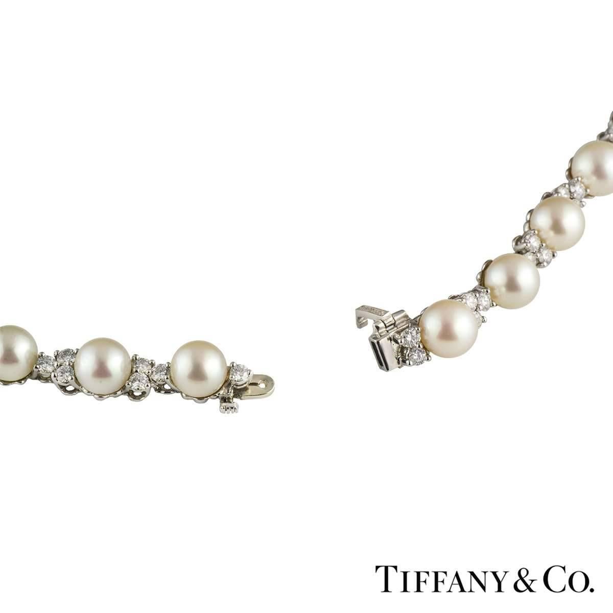 A beautiful Tiffany & Co pearl and diamond necklace in platinum from the Aria collection. The necklaces comprises of Akoya cultured pearls alternating with 3 round brilliant cut diamonds. There are 36 pearls and are of 6.5mm to 7mm in size.