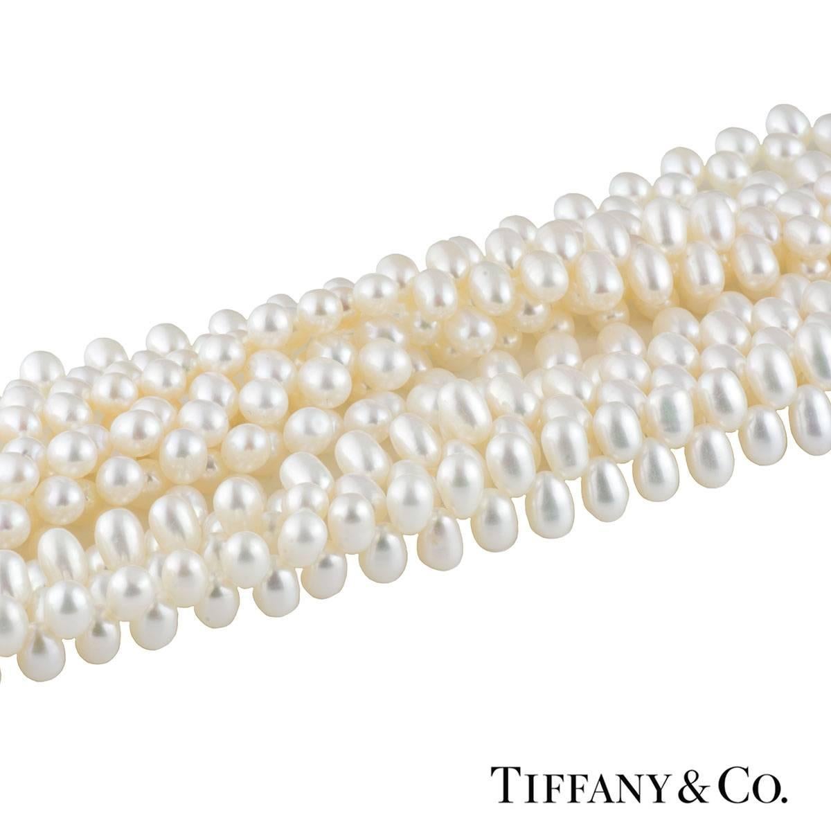 A unique silver Tiffany & Co. pearl torsade necklace from the Paloma Picasso collection. The necklace comprises of 8 rows of cultured pearls, oval shaped approximately 7mm. The necklace features a double toggle clasp which insert in each other