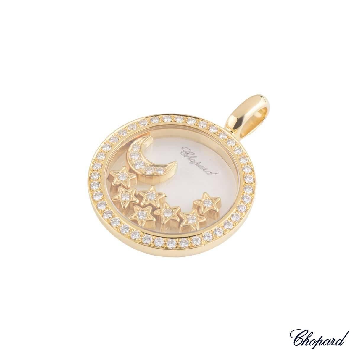 A classic 18k yellow gold Chopard diamond pendant from the Happy Diamonds collection. The pendant comprises of a circular motif with a glass centre containing 7 stars and a moon with diamonds in each one. There are a total of 31 round brilliant cut
