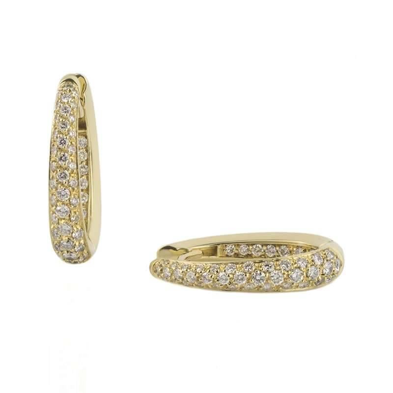 A pair of 18k yellow gold round brilliant cut diamond hoop earrings. The earrings are pave set with a vertical triple row of round brilliant cut diamonds graduating in size with a total weight of approximately 1.78ct G/H in colour and VS/SI in