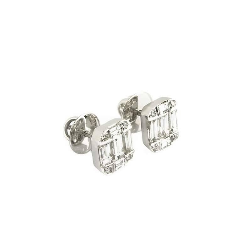 A pair of 18k white gold illusion set diamond earrings. The earrings are made up of 10 baguette cut diamonds totalling 2.00ct, along with 8 round brilliant cut diamonds totalling 0.13ct. The diamonds are predominantly H in colour and VS in clarity.