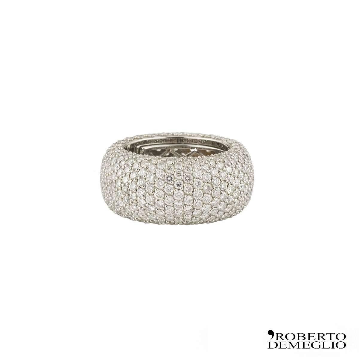 A sparkly 18k white gold Roberto Demeglio diamond ring. The ring comprises of a full pave set with round brilliant cut diamonds with a total of 7.31ct, F-G colour and VS clarity. The ring is a size O but has a spring function on the inside of the