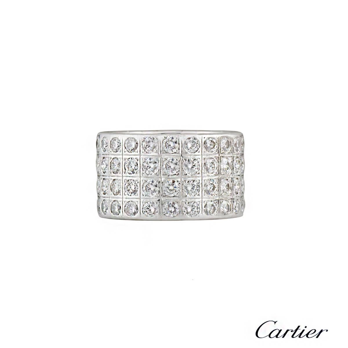 A Cartier 18k white gold and diamond ring from the Lanieres collection. The ring is composed of the signature series of squares, each containing a round brilliant cut diamond. There are a total of 84 round brilliant cut diamonds totalling