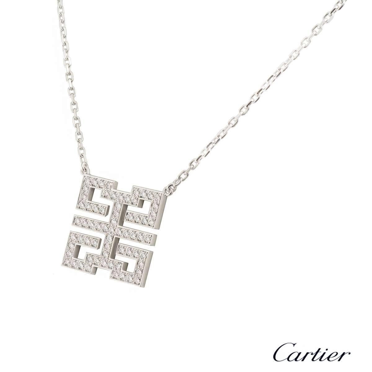 A stylish 18k white gold pendant by Cartier from the Le Baiser Du Dragon collection. The pendant features the dragon motif with 67 round brilliant cut diamonds pave set with a total weight of 0.87ct, G-H colour and VS clarity. The pendant comes with