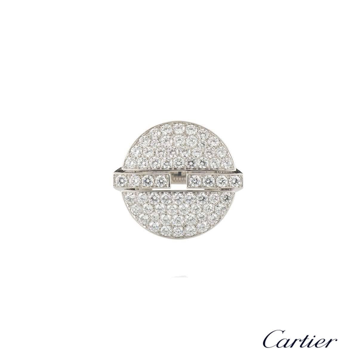A stunning 18k white gold diamond set Himalia ring by Cartier. The circular ring is fully pave set with 72 round brilliant cut diamonds totalling approximately 2.16, predominantly F colour and VS clarity. The motif is divided into two halves,