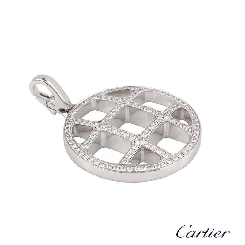 A stunning 18k white gold diamond set pendant from the Cartier Pasha collection. The open work circular pendant features the iconic square grid design and is accentuated by 110 round brilliant cut diamonds pave set throughout totalling approximately