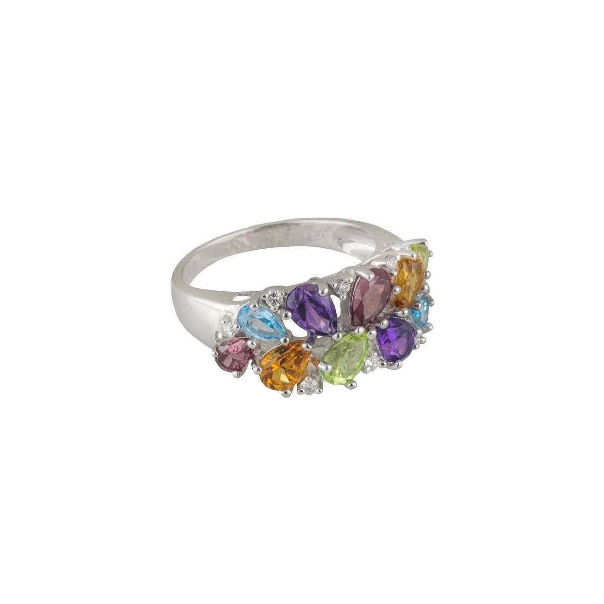 A unique 18k white gold diamond and multi-gemstone ring. The ring comprises of 8 round brilliant cut diamonds with a total weight of 0.13ct, H colour and VS-SI clarity. The ring also has various sizes of pear cut gemstones. The gemstones include;