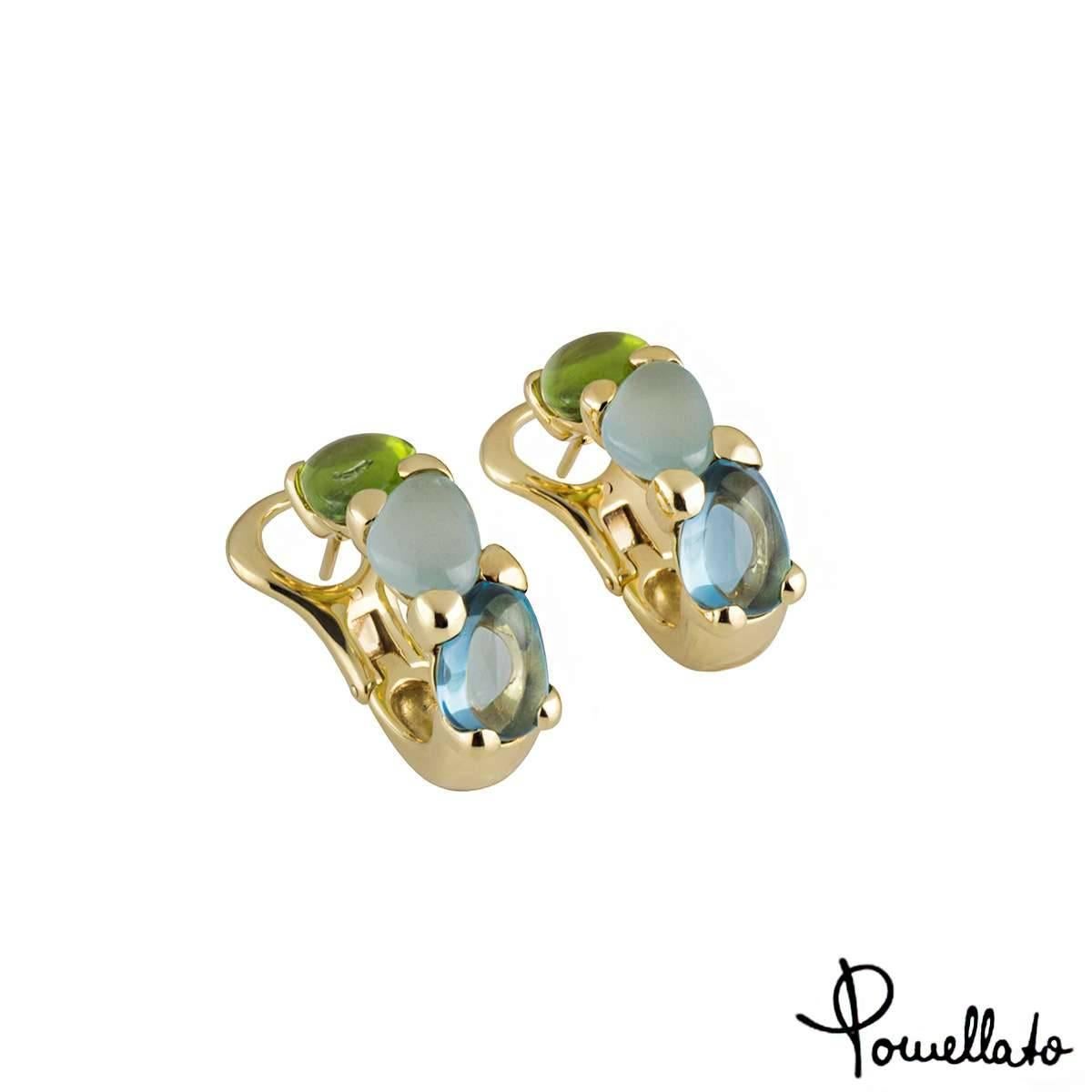 A unique pair of 18k yellow gold Pomellato multi-gemstone hoop earrings from the Saffi collection. Each earring comprises of a peridot, aquamarine and topaz set vertically in a prong setting. The earrings feature post and hinged clip fittings and