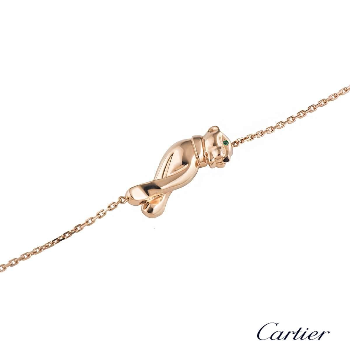 A luxurious 18k rose gold Cartier bracelet from the Panthere de Cartier collection. The bracelet comprises of a panthere motif with tsavorite eyes and a black lacquer nose. The motif has trace link chain featuring a lobster clasp and a loop. The