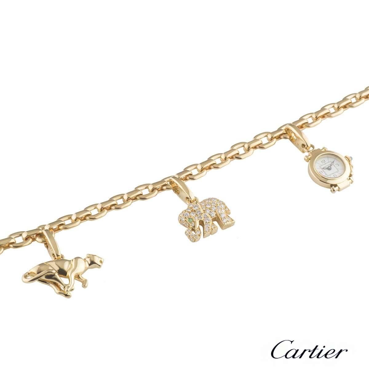 A lovely 18k yellow gold Cartier charm bracelet. The bracelet consists of 3 clip on charms all individually signed by Cartier, including a panthere charm, an elephant charm with an emerald eye and round brilliant cut diamonds and a small pasha clock