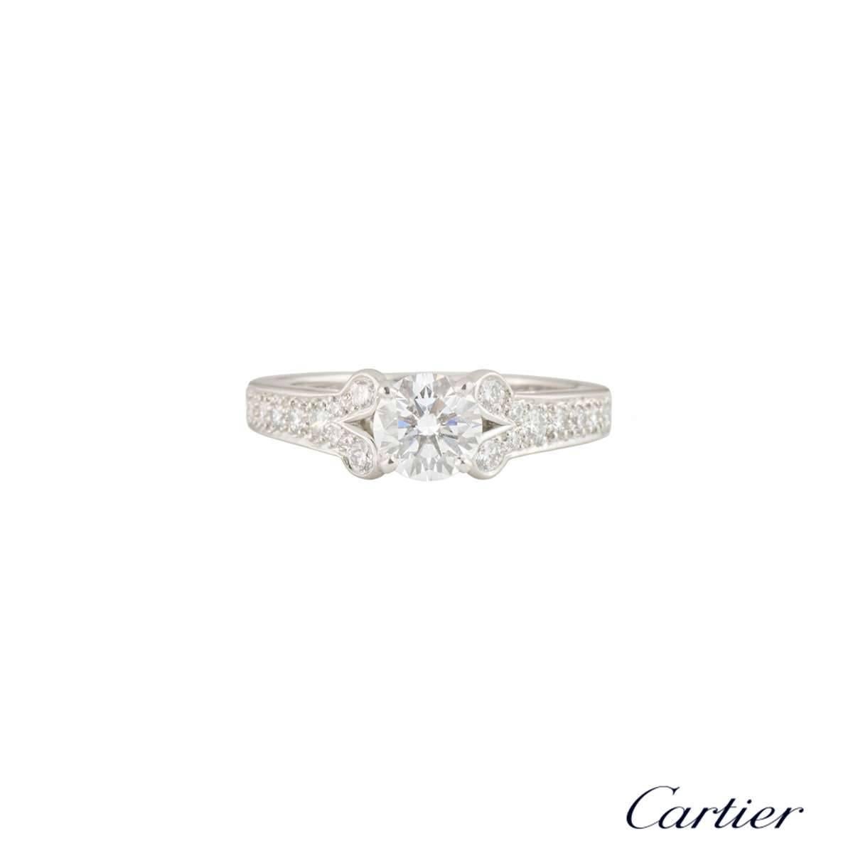 A stunning diamond engagement ring in platinum from the Ballerine collection by Cartier. The central 0.71ct round brilliant cut diamond is F colour and VS1 in clarity. The ring has diamond set rounded shoulders, set with 22 round brilliant cut