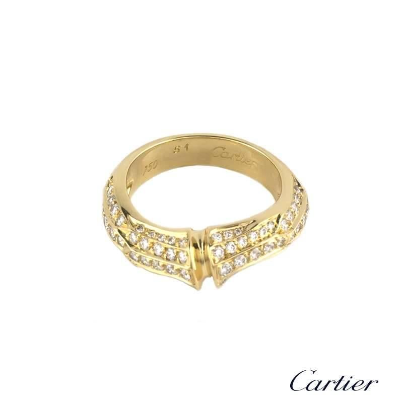 An 18k yellow gold diamond set ring from the Cartier Bamboo collection. The ring is set to the front with a bamboo design, pave set with round brilliant cut diamonds totalling approximately 0.82ct, and is complemented by a brushed finish to the back