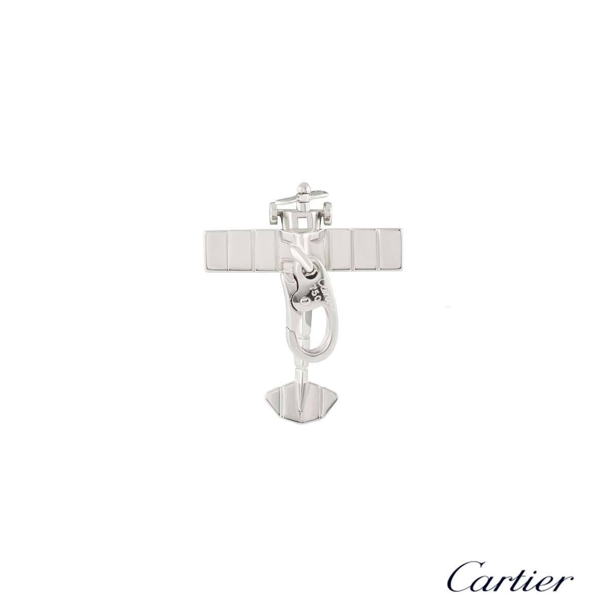 A unique 18k white gold Airplane charm by Cartier. The charm is designed as a mini Monoplane, complete with a rotational propeller to the front. The charm measures 2cm x 2.3cm and features a lobster clasp attached to the top, with a gross weight of