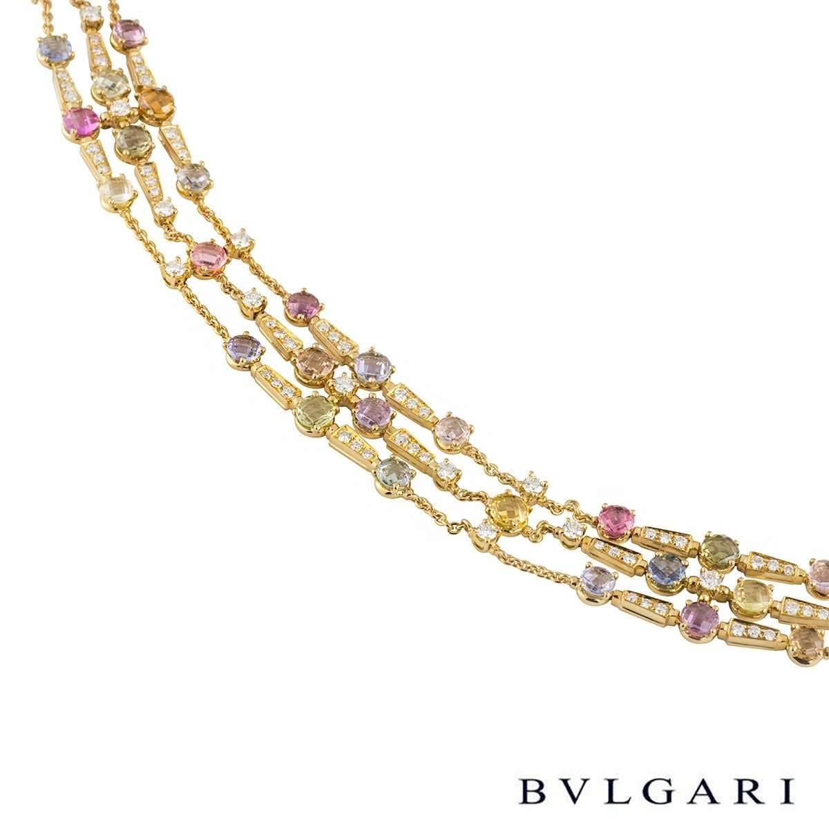 A beautiful 18k yellow gold Bvlgari multi-gemstone necklace from the Rosette collection. The necklace is of a choker style and comprises of 3 chained rows of 47 fancy sapphires and 28 diamonds in a 4 claw setting, abstractly placed. The total