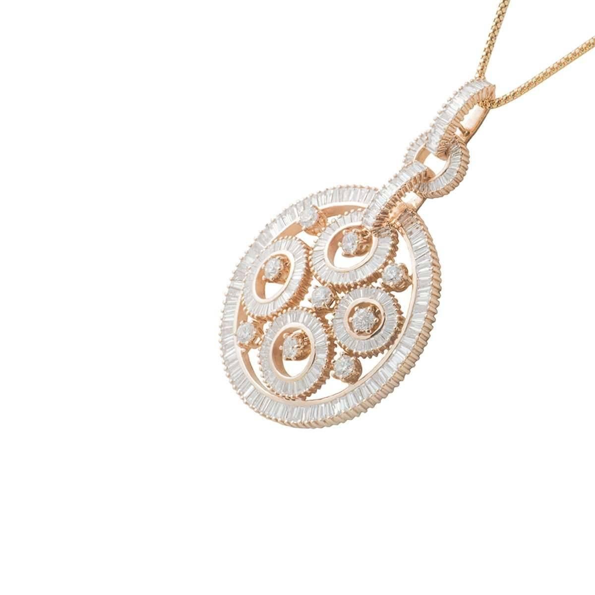 A beautiful 18k rose gold diamond pendant. The pendant comprises of an open work hoops and circles design with 9 round brilliant cut diamonds and 298 baguette cut diamonds. The diamonds have a total diamond weight of approximately 6.86ct, F colour