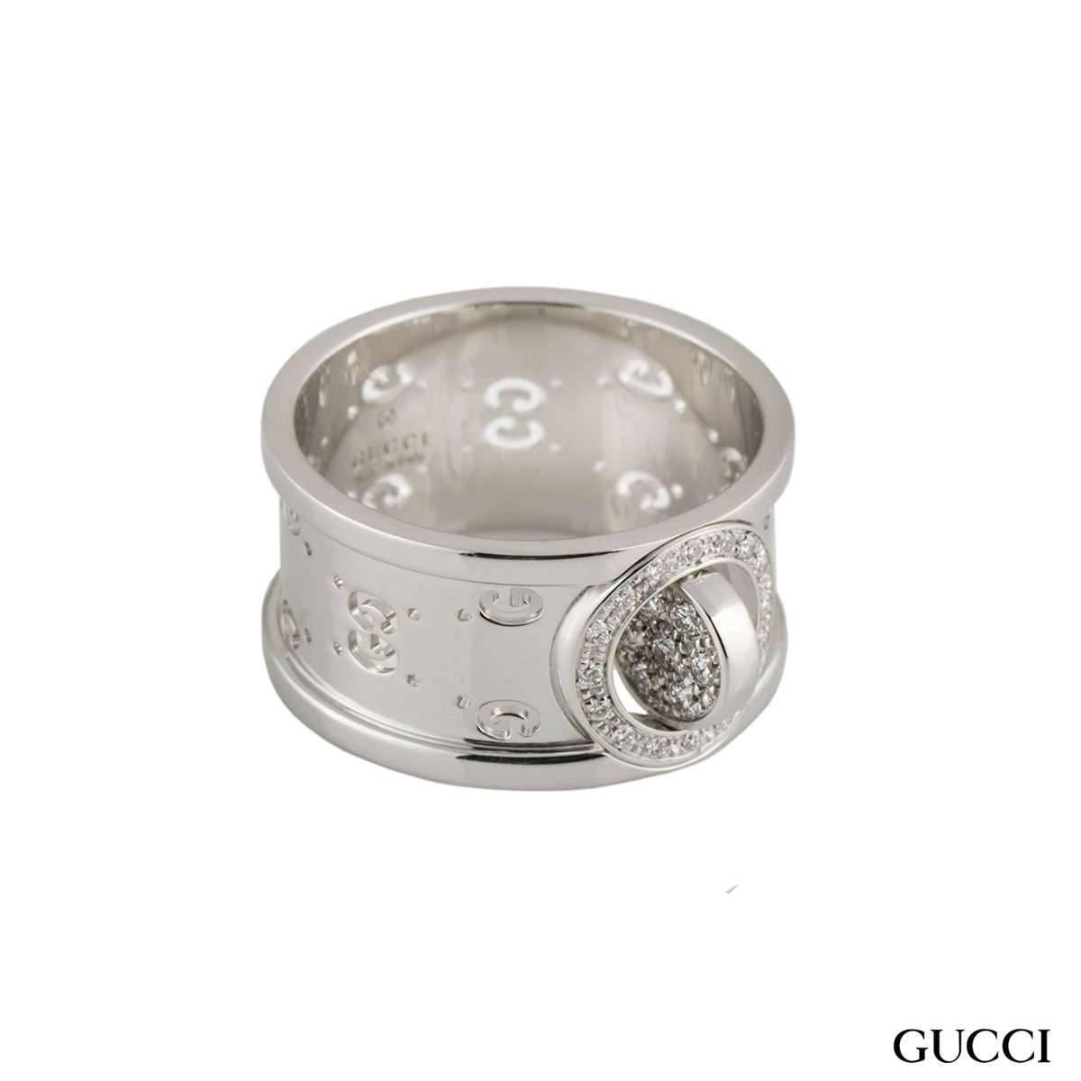 An 18k white gold diamond set Gucci ring from the Twirl collection. The ring comprises of 24 round brilliant cut diamonds set to the centre with a spinning centre, with a total diamond weight of approximately 0.16ct, G colour and VS clarity. The