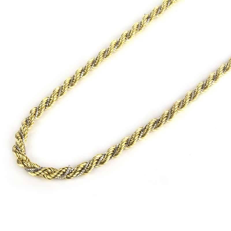 An 18k yellow and white gold necklace and bracelet. The matching twist rope design is composed of  an 18k yellow gold strand entwined with a smaller 18k white gold strand. The necklace is 24 inches in length and the bracelet would fit a wrist up to