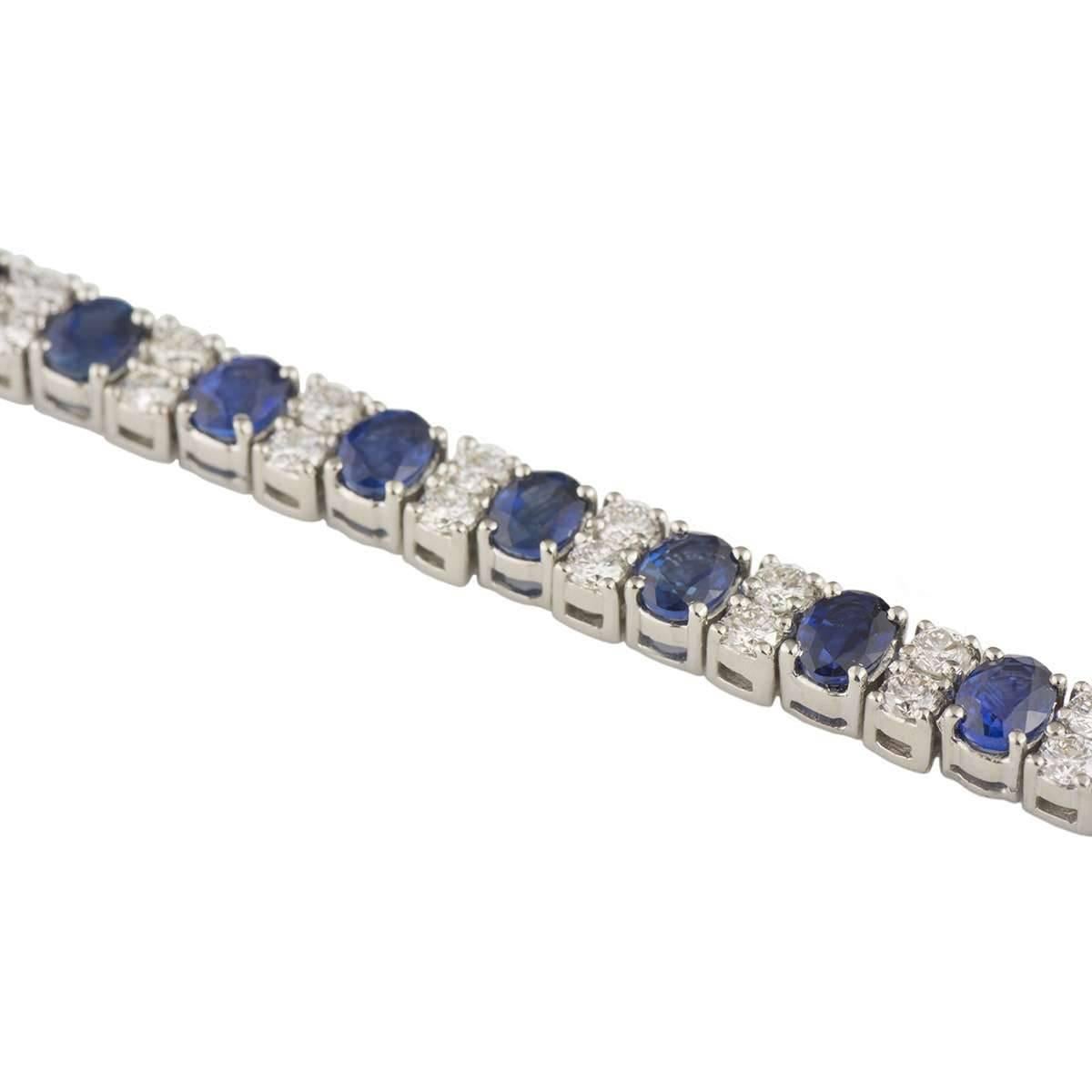 A beautiful 18k white gold sapphire and diamond bracelet. The bracelet comprises of 29 oval cut sapphires alternating with diamonds totalling 58 round brilliant cuts. The sapphires have a total weight of 5.77ct with a deep blue hue throughout. The