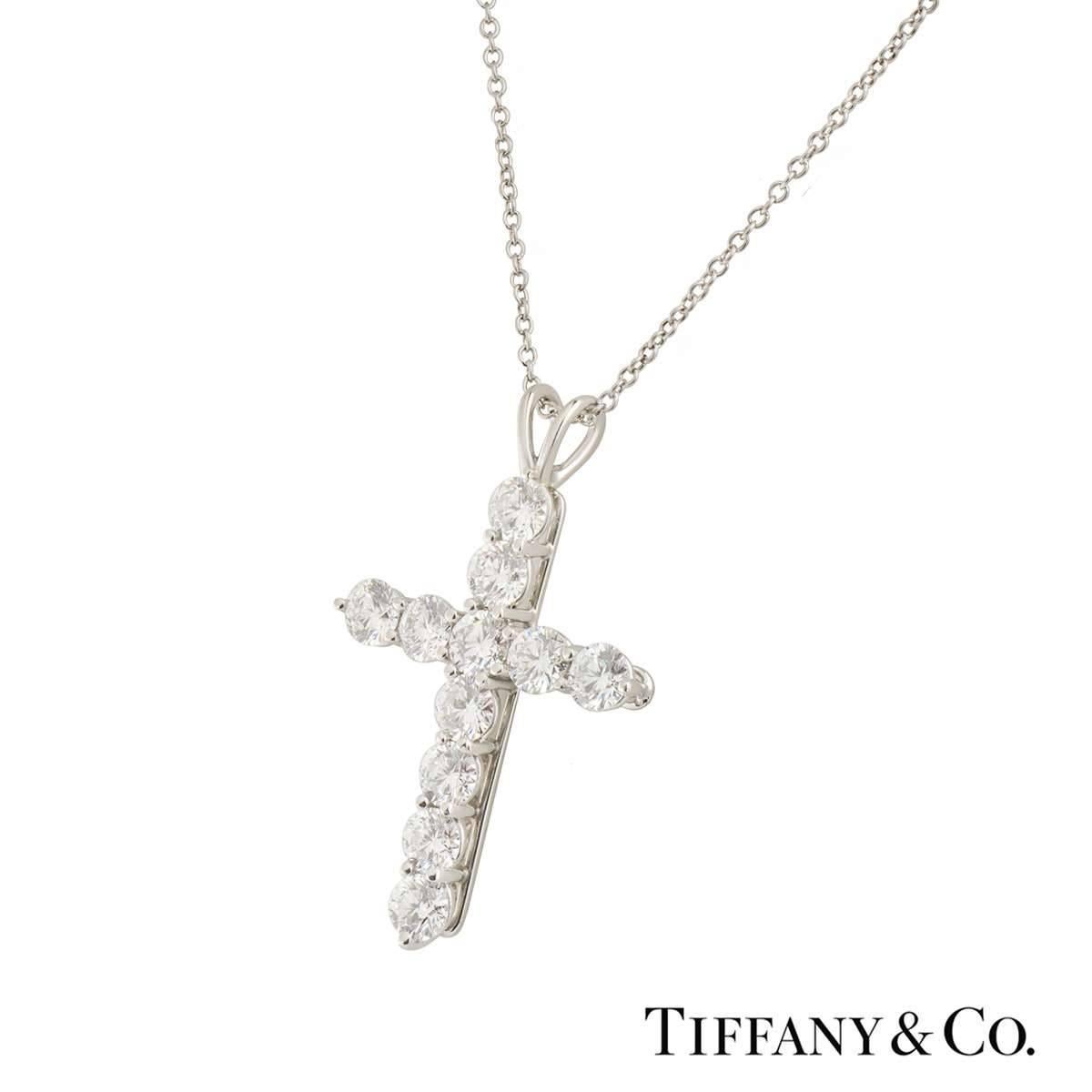 A Tiffany & Co. diamond cross pendant in platinum. The pendant is made up of 11 round brilliant cut diamonds totalling approximately 1.65ct, the diamonds are G colour and VS2 clarity. The pendant measures, 2.7cm in length and 2cm in width, on the