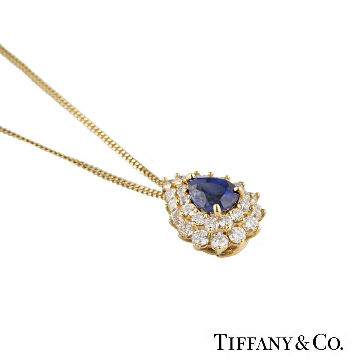 A timeless 18k yellow gold Tiffany & Co. sapphire and diamond pendant. The pendant comprises of a pear cut sapphire with an approximate total weight of 1.00ct, with a deep blue hue throughout. Complimenting this are 29 round brilliant cut