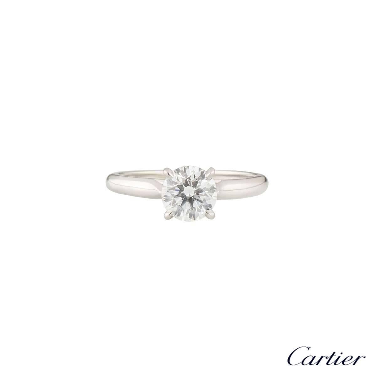 A beautiful platinum Cartier diamond engagement ring from the 1895 Solitaire collection. The ring comprises of a round brilliant cut diamond in a 4 claw setting with a total weight of 1.08ct, H colour and VS1 clarity. The ring is currently a UK size