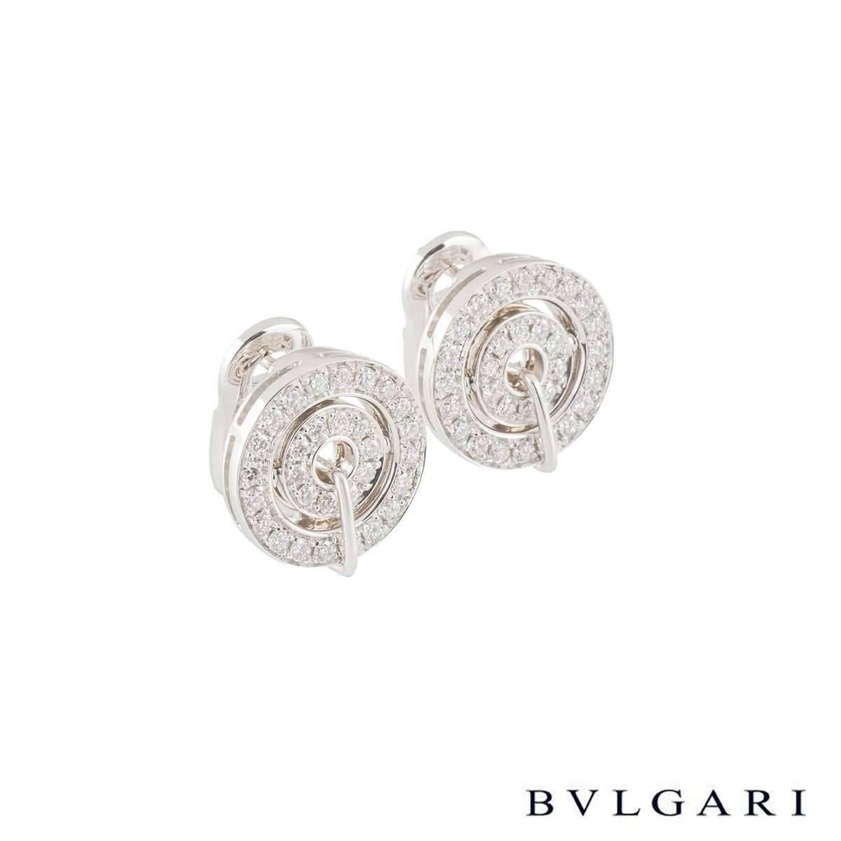 A beautiful pair of 18k white gold earrings from the Astrale collection by Bvlgari. The circular openwork earrings are each set with an inner circle set with 10 diamonds and the outer set with 20 diamonds. The round brilliant cut diamonds have a