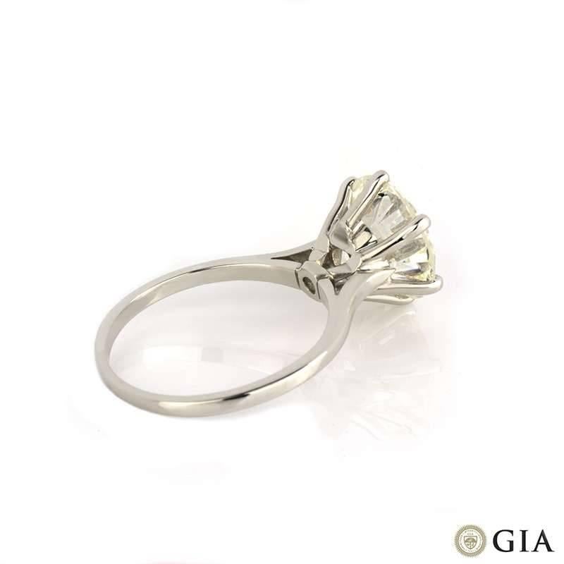 An amazing single stone diamond ring in platinum. The outstanding round brilliant cut diamond weighs 4.02ct, is J in colour and VS2 in clarity set within a tapered contemporary 6 claw mount. The 1.5mm ring is currently a size L but can be adjusted