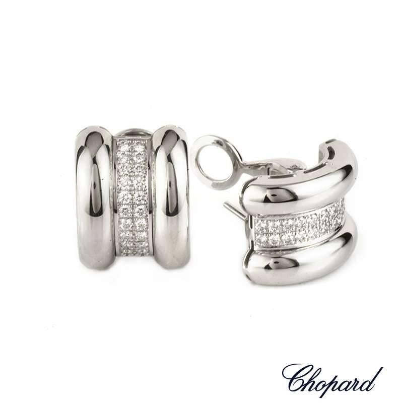 A classic pair of Chopard 18k white gold and diamond earrings from the La Strada collection. The earrings are comprised of three sections and cuff over the earlobe, the inner is pave set with 44 round brilliant cut diamonds totalling 0.92ct. The