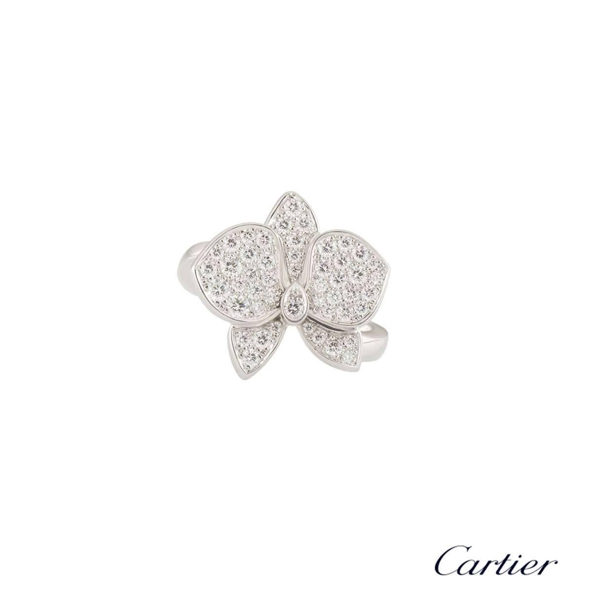 A beautiful 18k white gold Cartier diamond dress ring from the Caresse d'Orchidees collection. The ring comprises of an orchid motif pave set with 49 round brilliant cut diamonds. The diamonds have a total weight of 0.54ct, G colour and VS+ clarity.