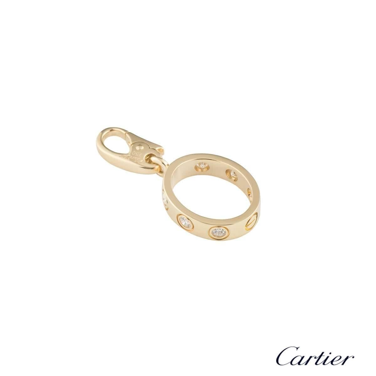 An 18k yellow gold Love charm by Cartier. The oval shape charm features a single screw motif and 6 round brilliant cut diamonds set around the outer edge, totalling approximately 0.18ct. The charm measures 2.5cm in length x 3mm in width and has an