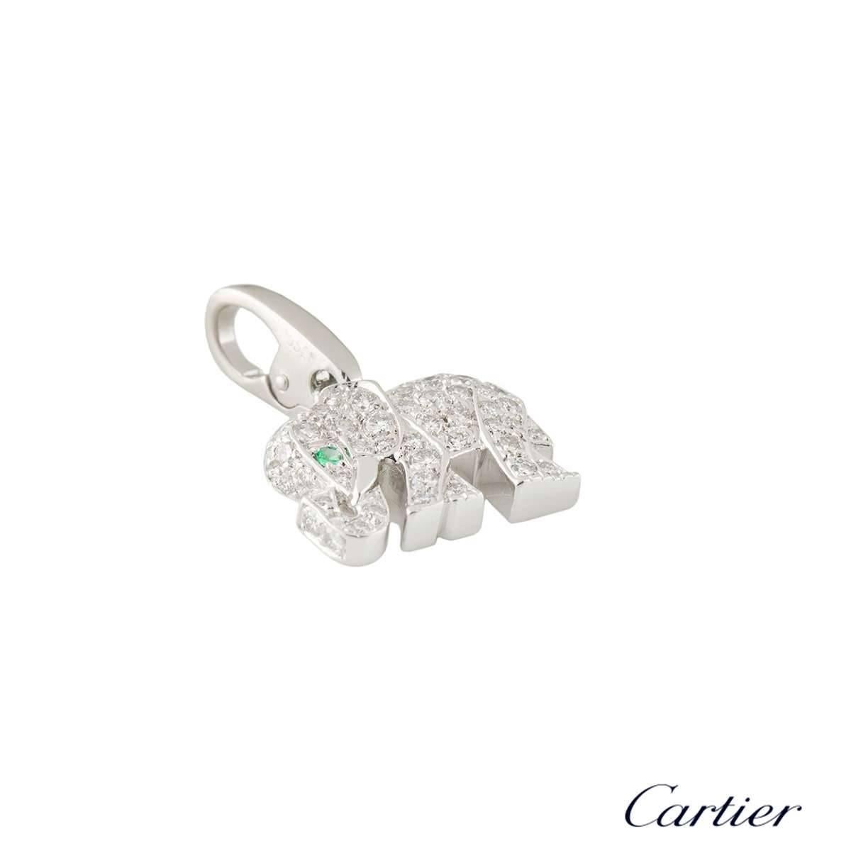 A sparkly 18k white gold diamond Cartier charm. The charm comprises of an elephant motif encrusted with 60 round brilliant cut diamonds with a total weight of approximately 0.40ct, G colour and VS clarity. The charm has a round cut emerald which