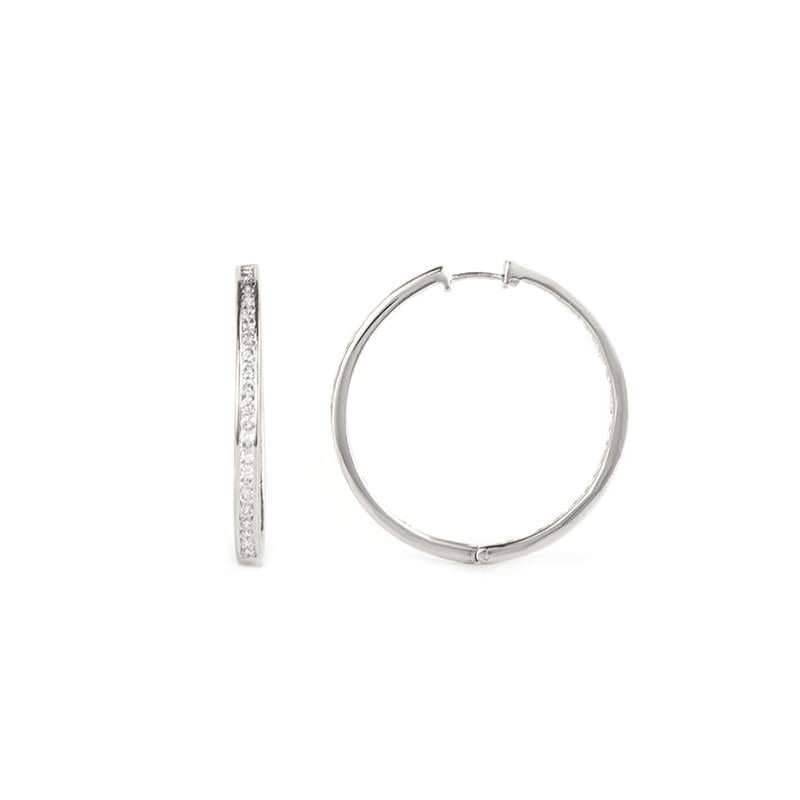 A pair of diamond set hoop earrings in 18k white gold. The earrings are each set with 44 round brilliant cut diamonds totalling 2.59ct, colour G and VS clarity, set to the front and the inner side of the hoop to create a full effect. The hoops