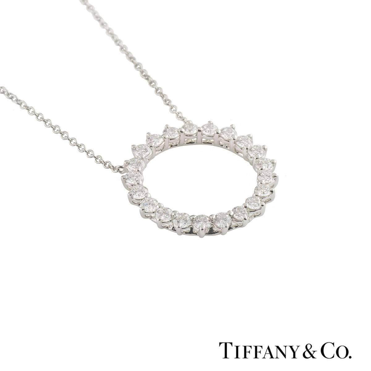 A stunning pendant in platinum from the Open Circle collection by Tiffany & Co. The openwork circular pendant consists of 21 round brilliant cut diamonds totalling 0.93ct, predominantly F colour and VS clarity. The motif measures 2cm in diameter