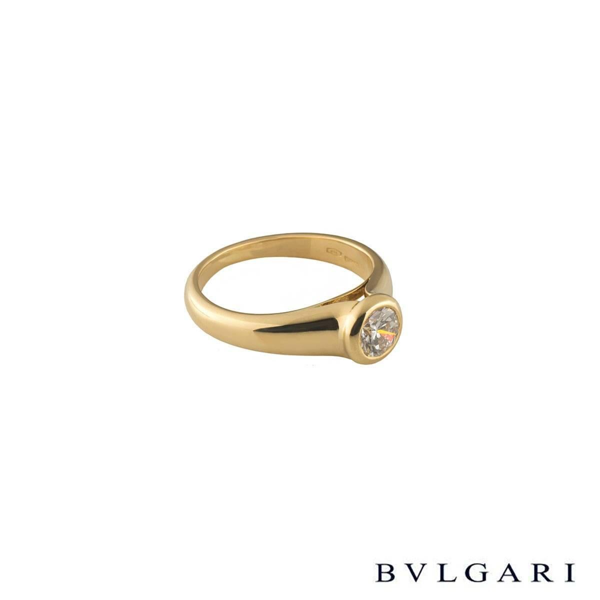 A unique 18k yellow gold Bvlgari diamond engagement ring. The ring comprises of a round brilliant cut diamond with a total weight of 0.49ct, F colour and VS1 clarity, set in a rubover setting. The ring is a US 4 1/4, EU size 47.5 and UK size I but