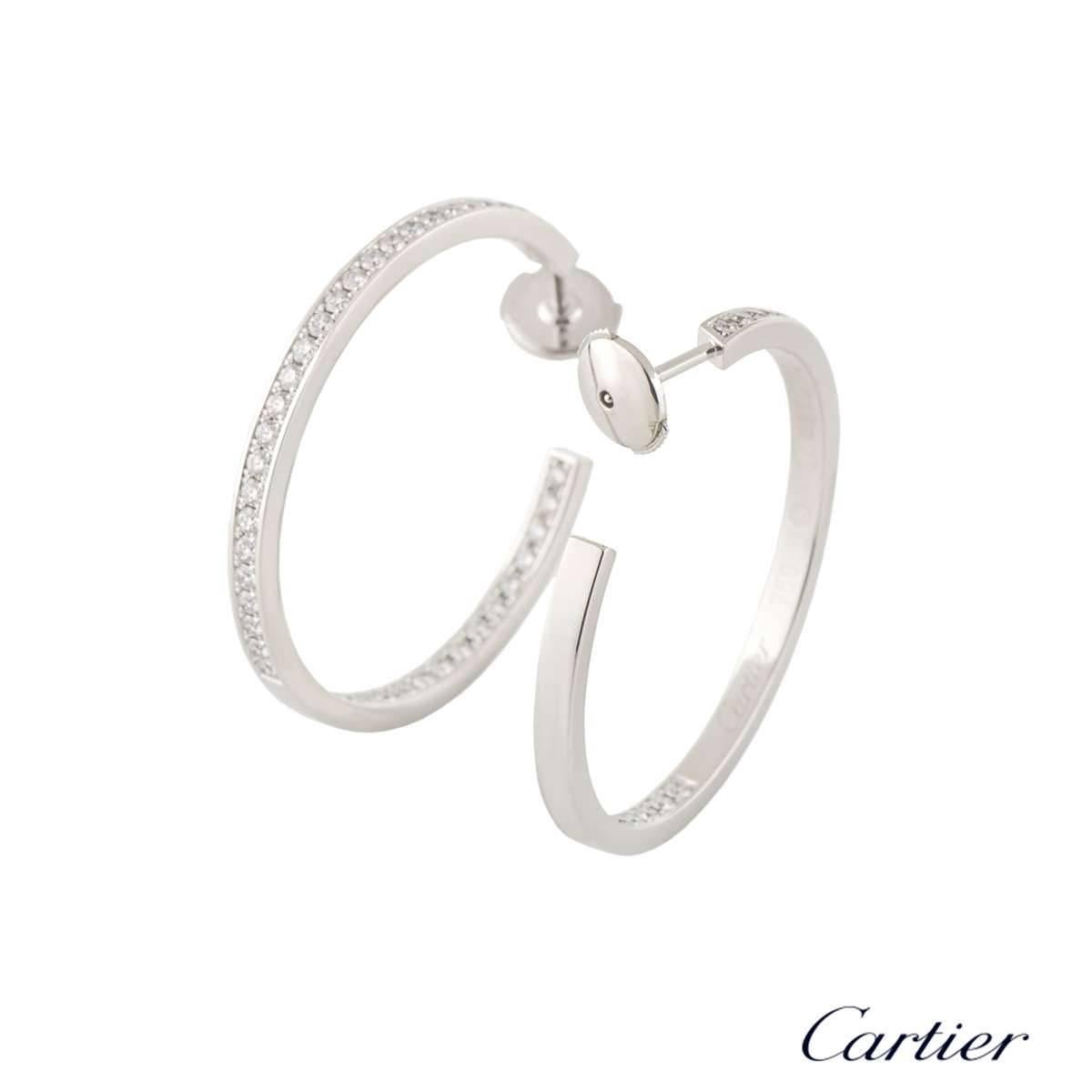 A beautiful pair of 18k white gold Cartier diamond hoop earrings. The earrings each feature 45 round brilliant cut diamonds in a pave setting with a total of approximately 1.60ct, predominantly G+ colour and VS+ clarity, both set on the inner side